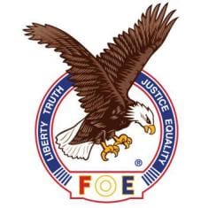 Emblem of the Fraternal Order of Eagles featuring a soaring eagle.